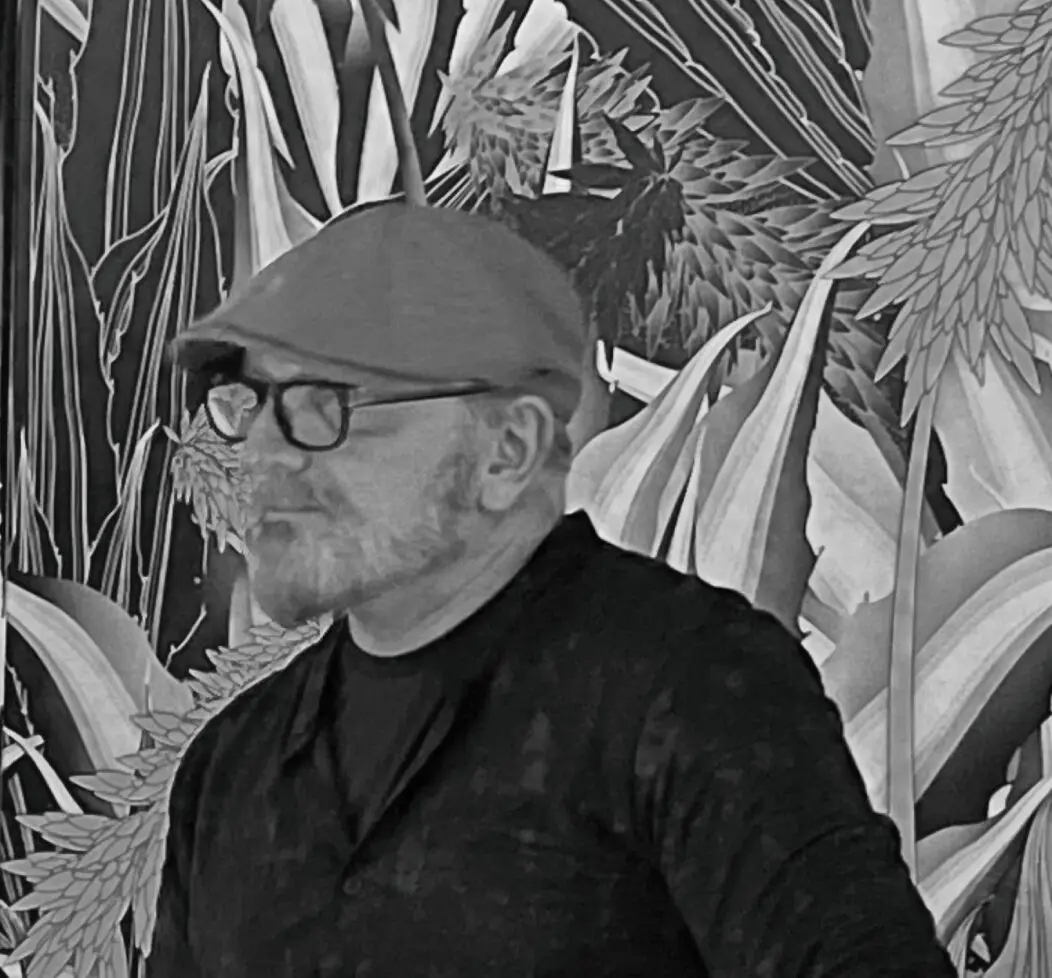 Man in cap and glasses, abstract background.